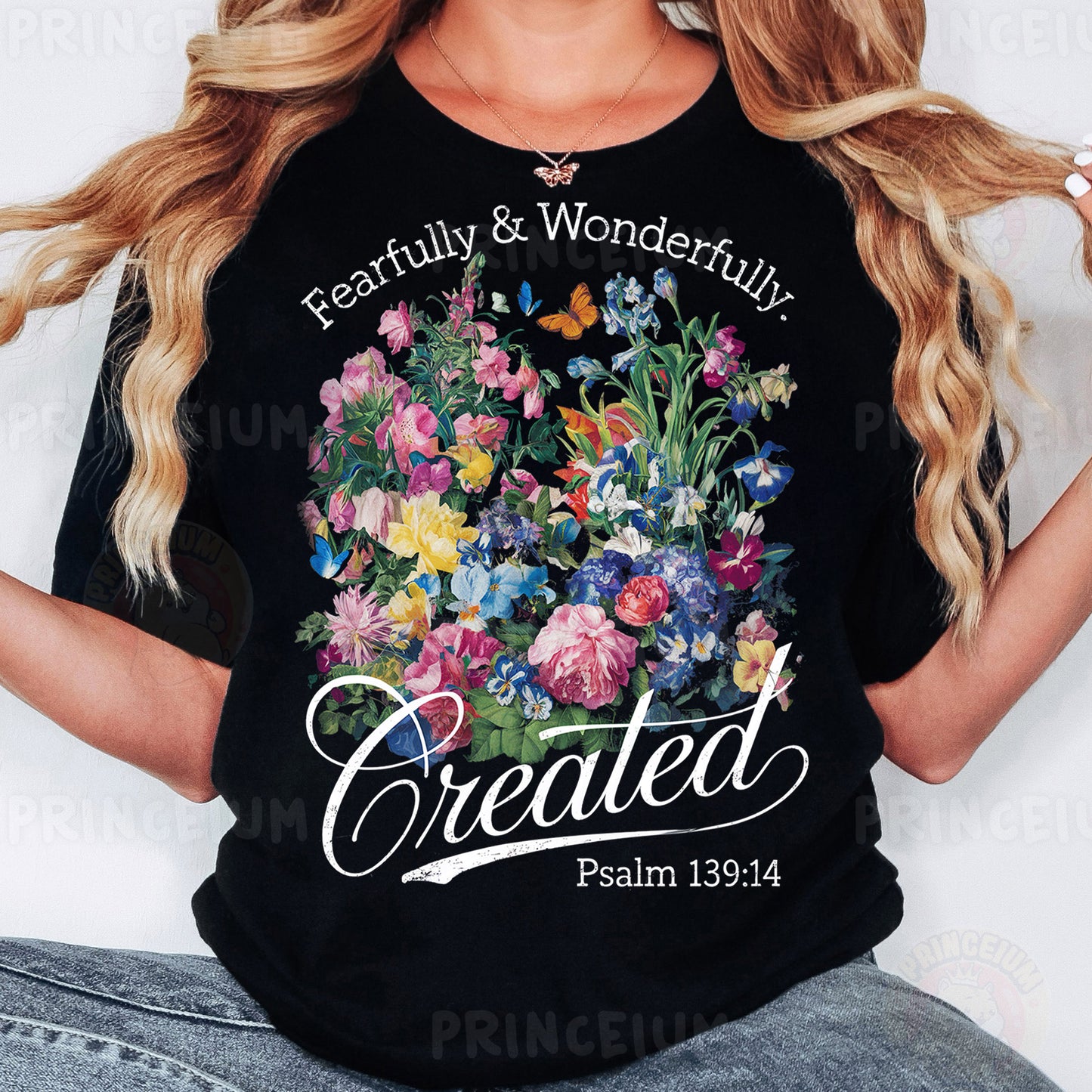 a woman wearing a black t - shirt with flowers on it