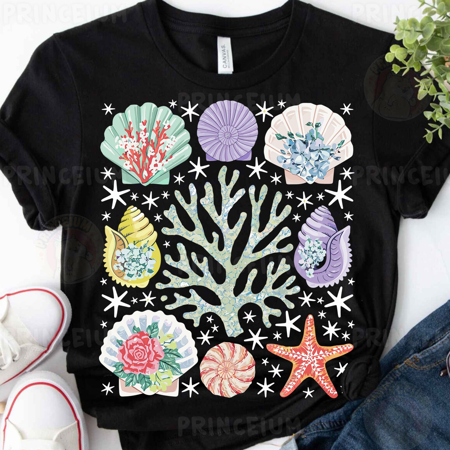 a black t - shirt with colorful seashells and starfish on it