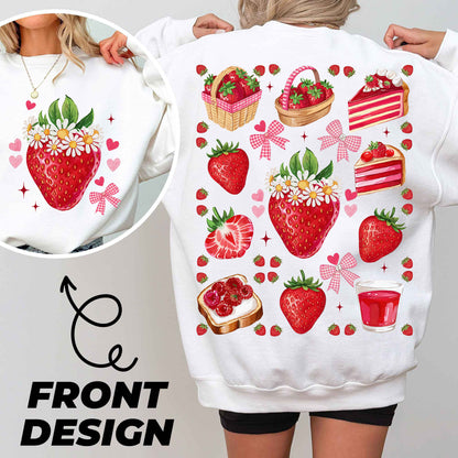 a woman wearing a white sweatshirt with strawberries on it