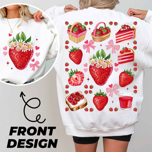 a woman wearing a white sweatshirt with strawberries on it