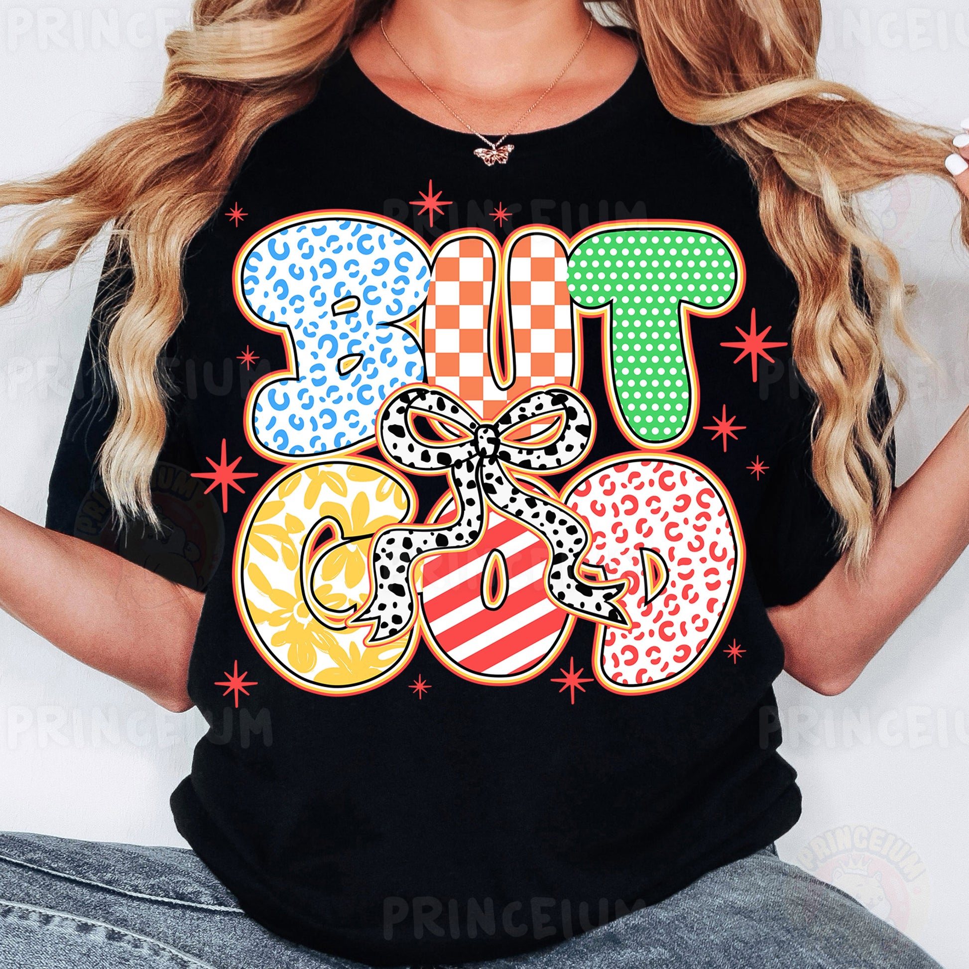 a woman wearing a black tshirt with colorful letters
