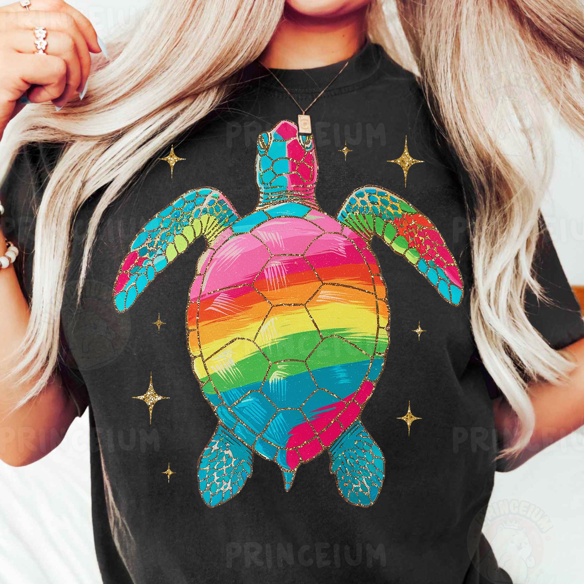 a woman wearing a black shirt with a rainbow turtle on it