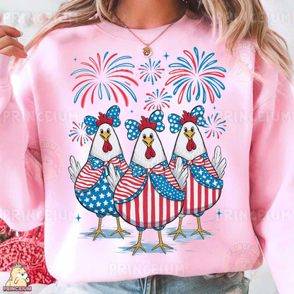 a woman wearing a pink shirt with three chickens on it