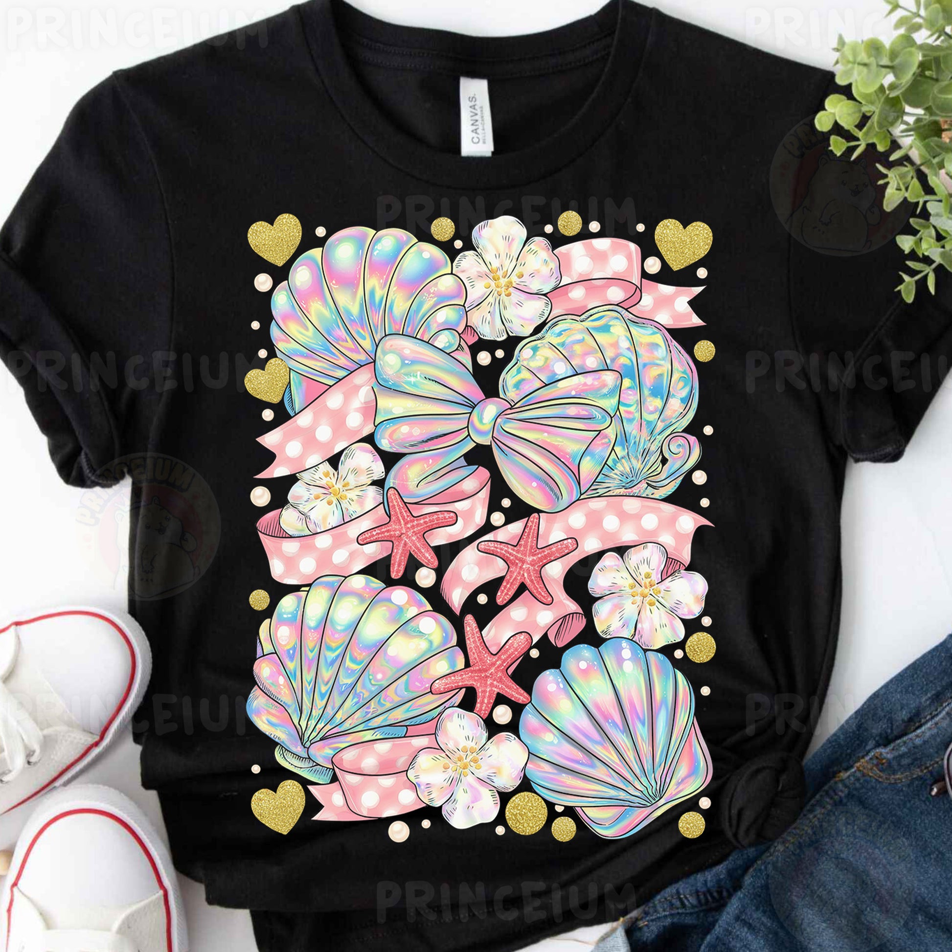 a black t - shirt with pink, blue, and green seashells on