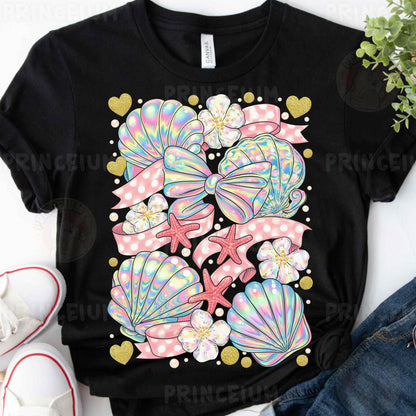 a black t - shirt with pink, blue, and green seashells on