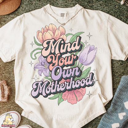 a t - shirt that says mind your own motherhood
