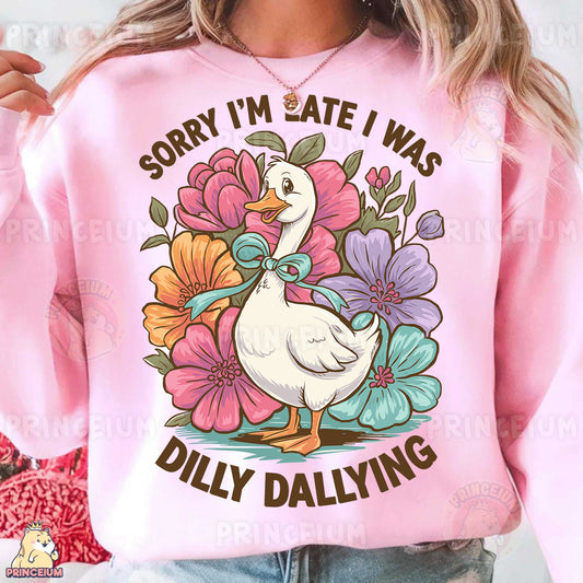 a woman wearing a pink sweatshirt that says sorry i'm late i was dil