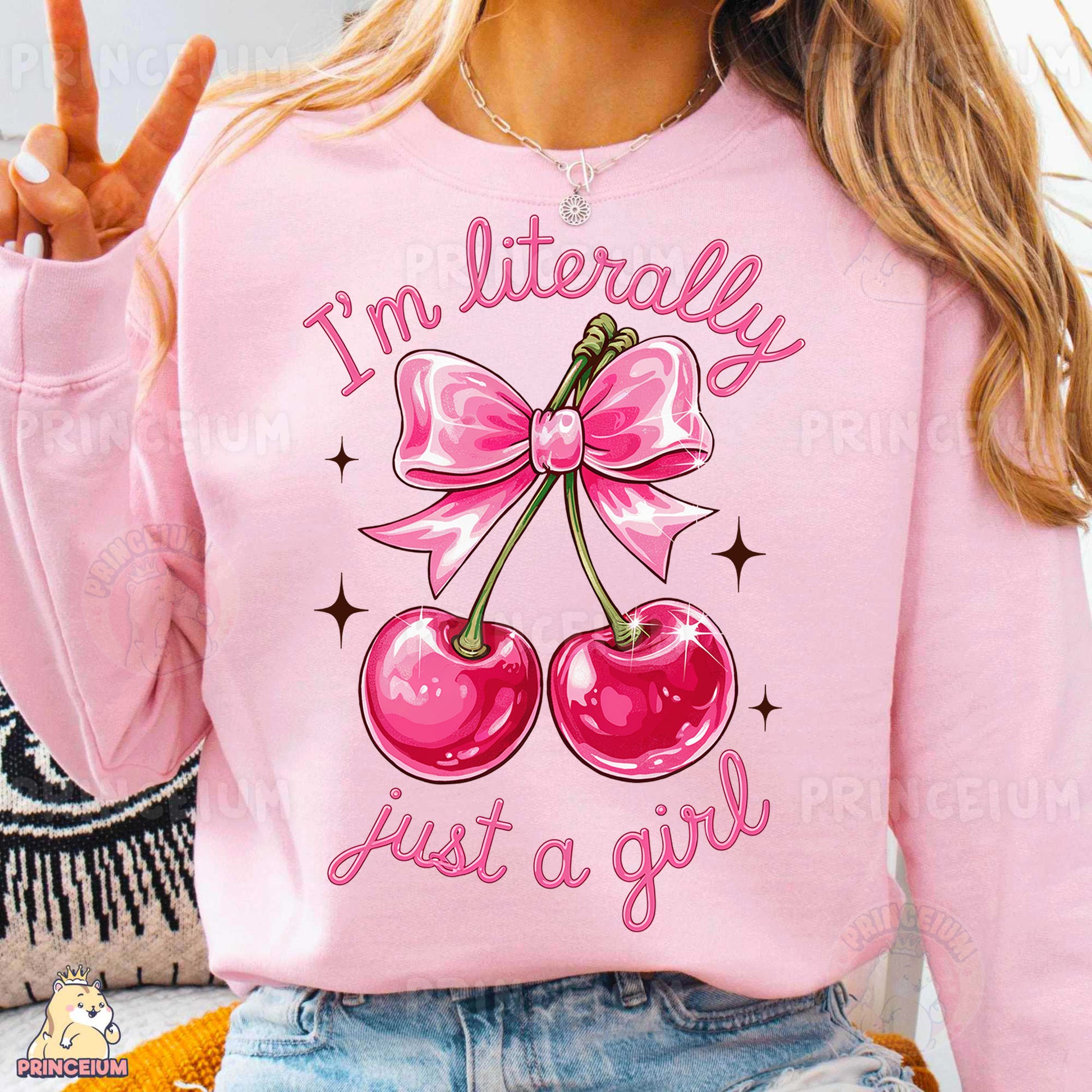 a woman wearing a pink sweatshirt with two cherries on it