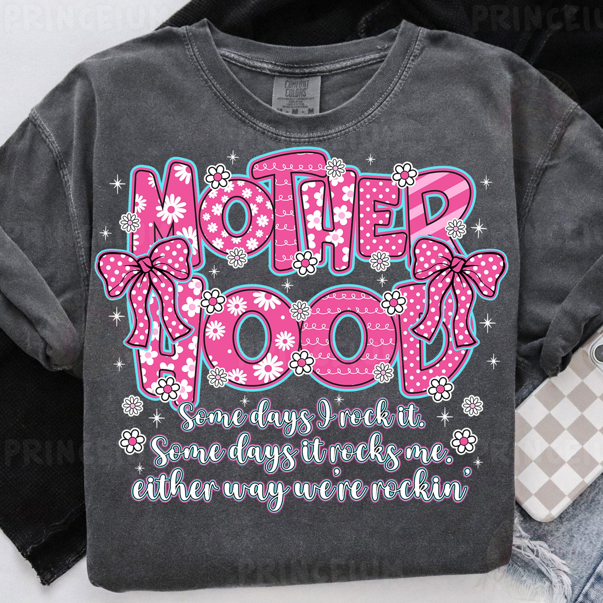 a t - shirt with the words motherhood printed on it