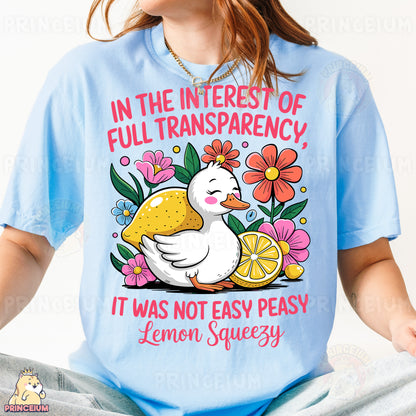 a woman wearing a t - shirt with a picture of a duck holding a lemon