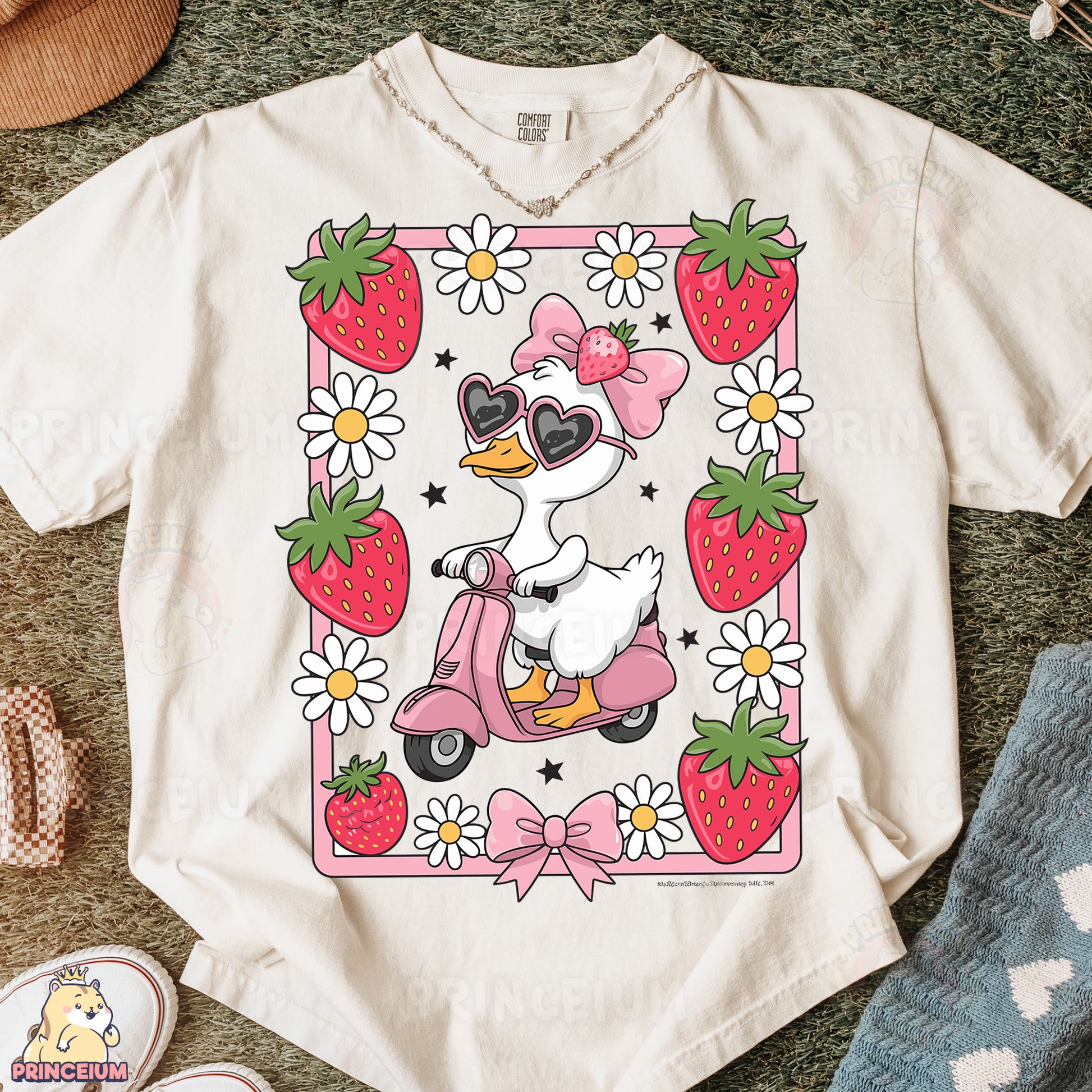 a t - shirt with a duck riding a scooter