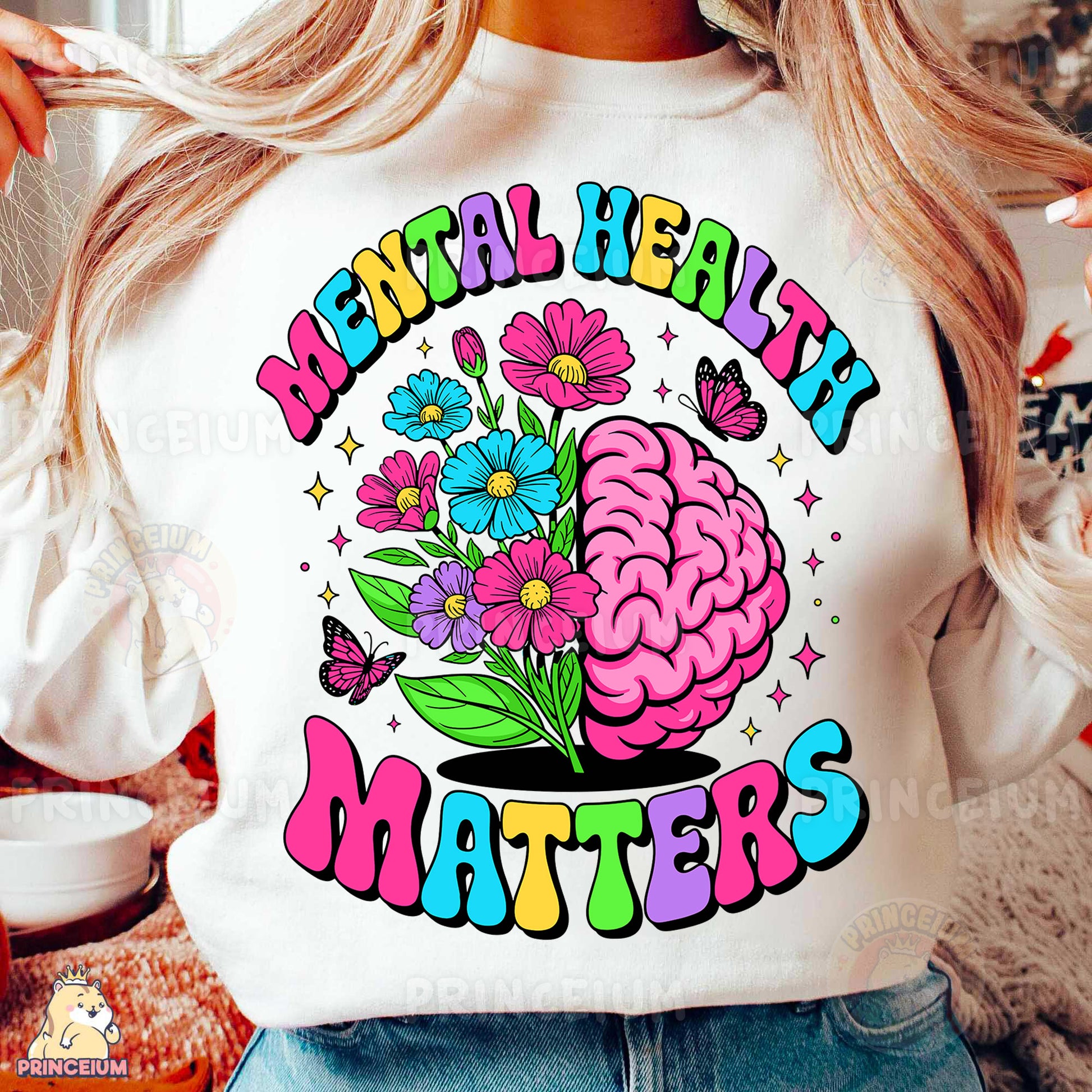 a woman wearing a white shirt with a flower brain on it