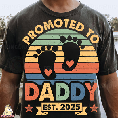 a man wearing a t - shirt with a baby feet on it