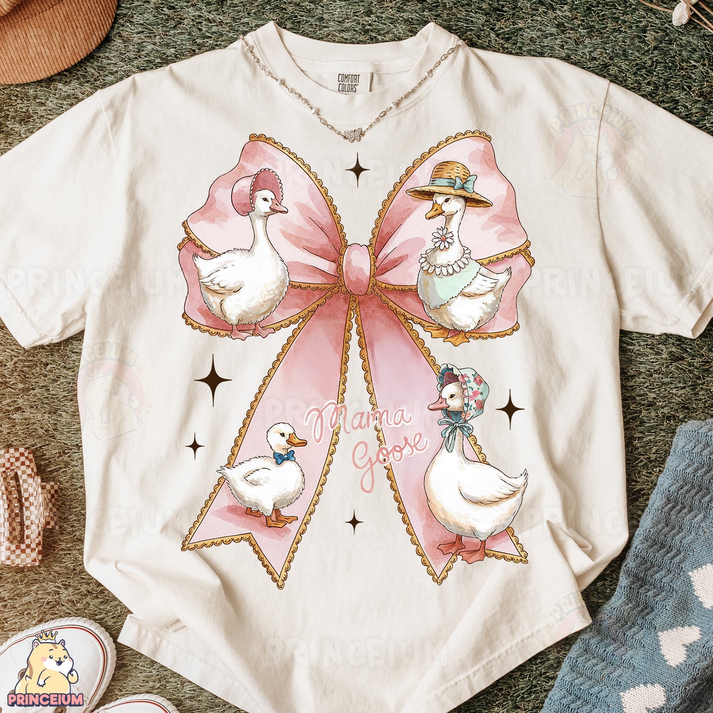a white shirt with a pink bow and ducks on it