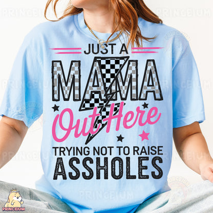 a woman sitting on a bed wearing a t - shirt that says just a mama