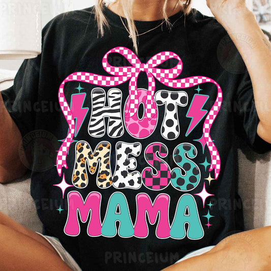 a woman sitting on a couch wearing a black shirt with a pink bow