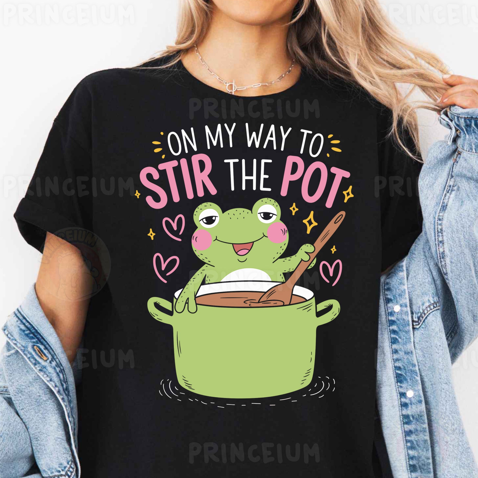 a woman wearing a black t - shirt that says on my way to stir the