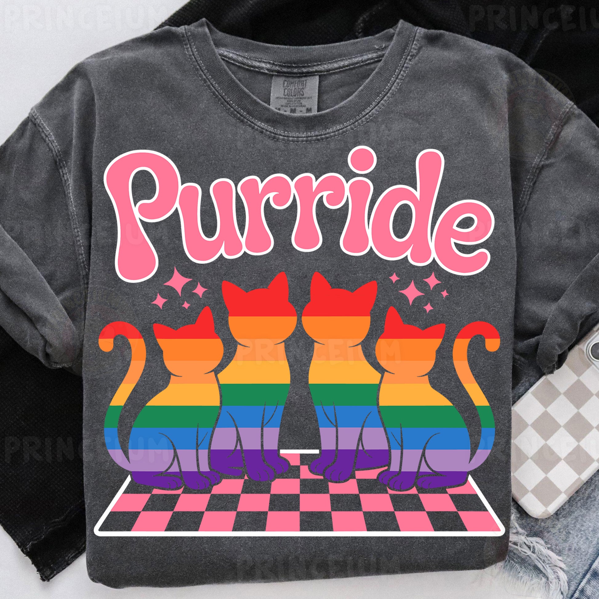 a black shirt with a rainbow cat design on it