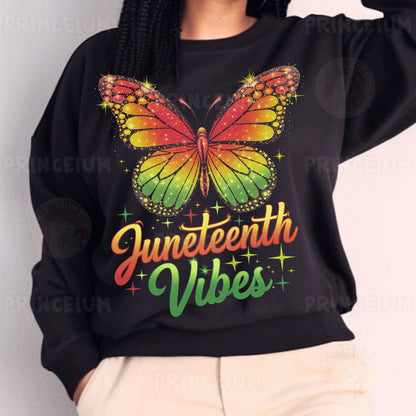 a woman wearing a black sweater with a butterfly on it