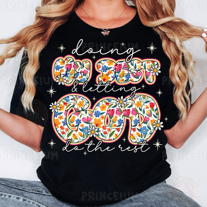 a woman wearing a black t - shirt with a floral design