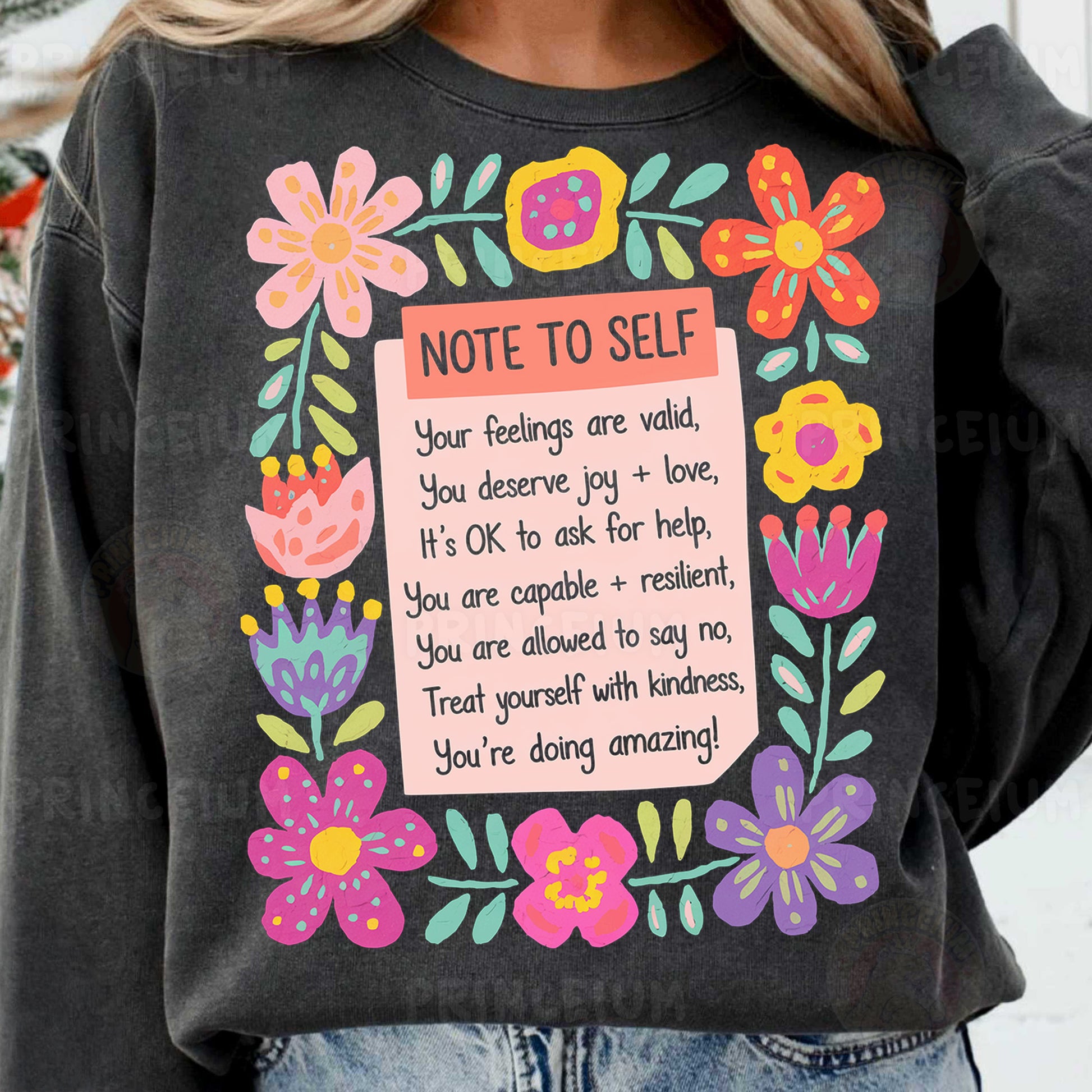 a woman wearing a sweatshirt with a note to self on it