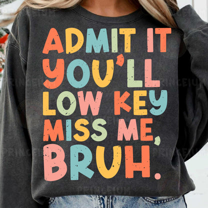 a woman wearing a sweatshirt that says admit it you'll low key miss me