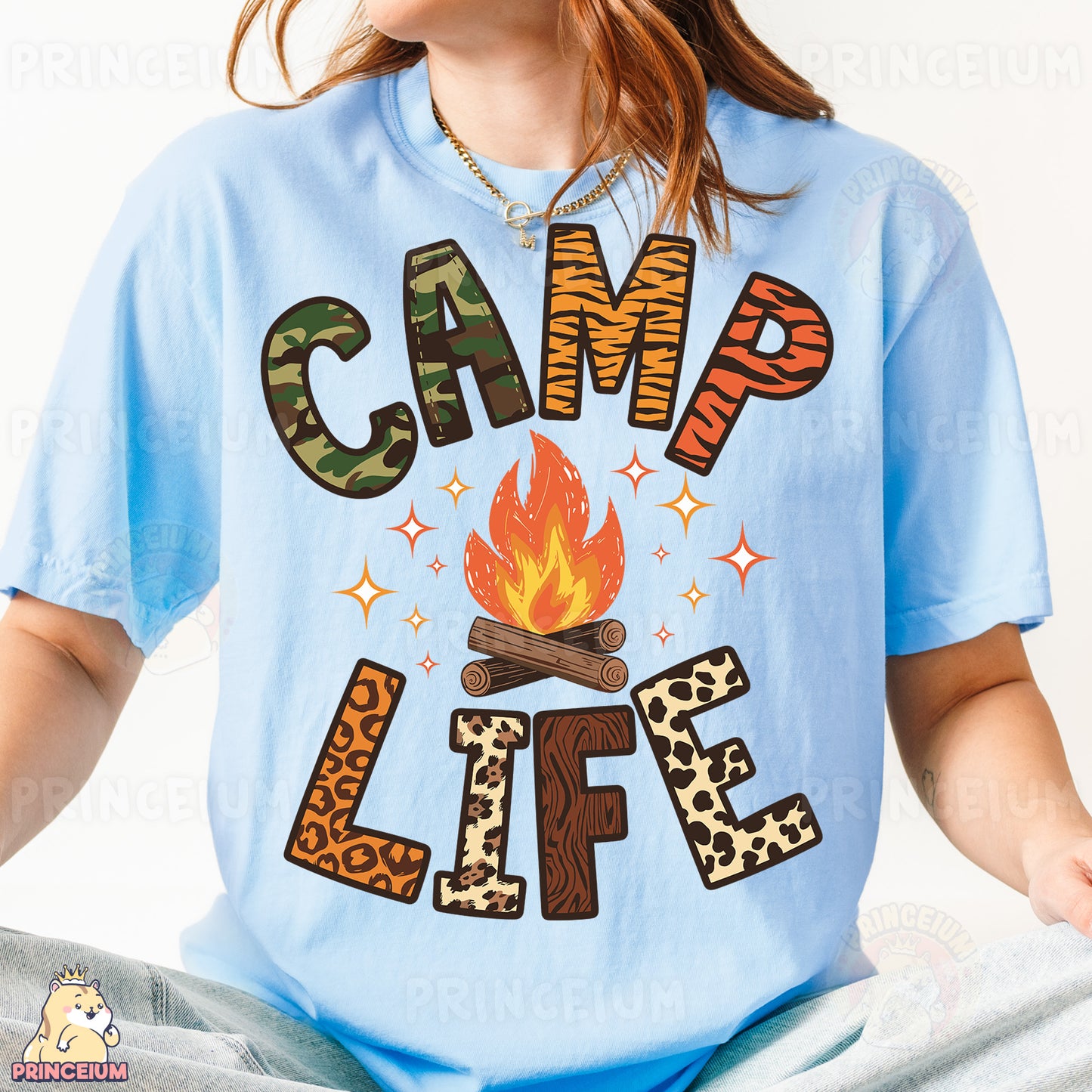 a girl wearing a camp life t - shirt sitting on a bed