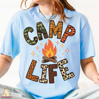 a girl wearing a camp life t - shirt sitting on a bed