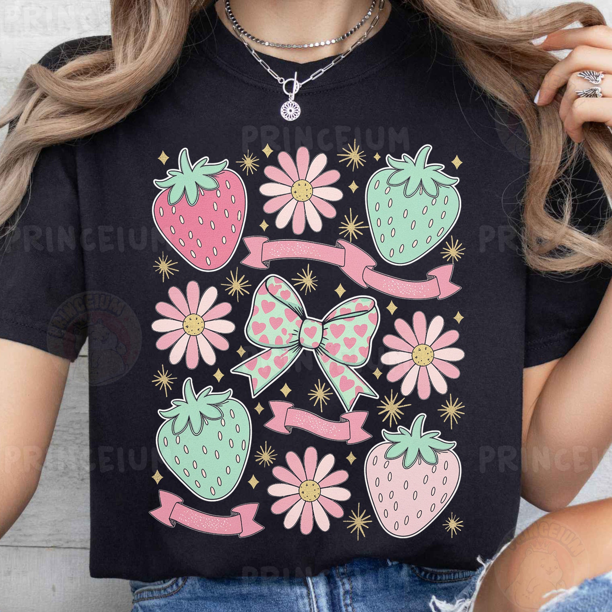 a woman wearing a black t - shirt with pink flowers and strawberries on it