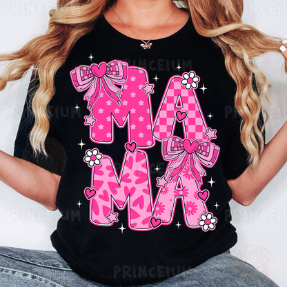 a woman wearing a black shirt with pink letters and bows