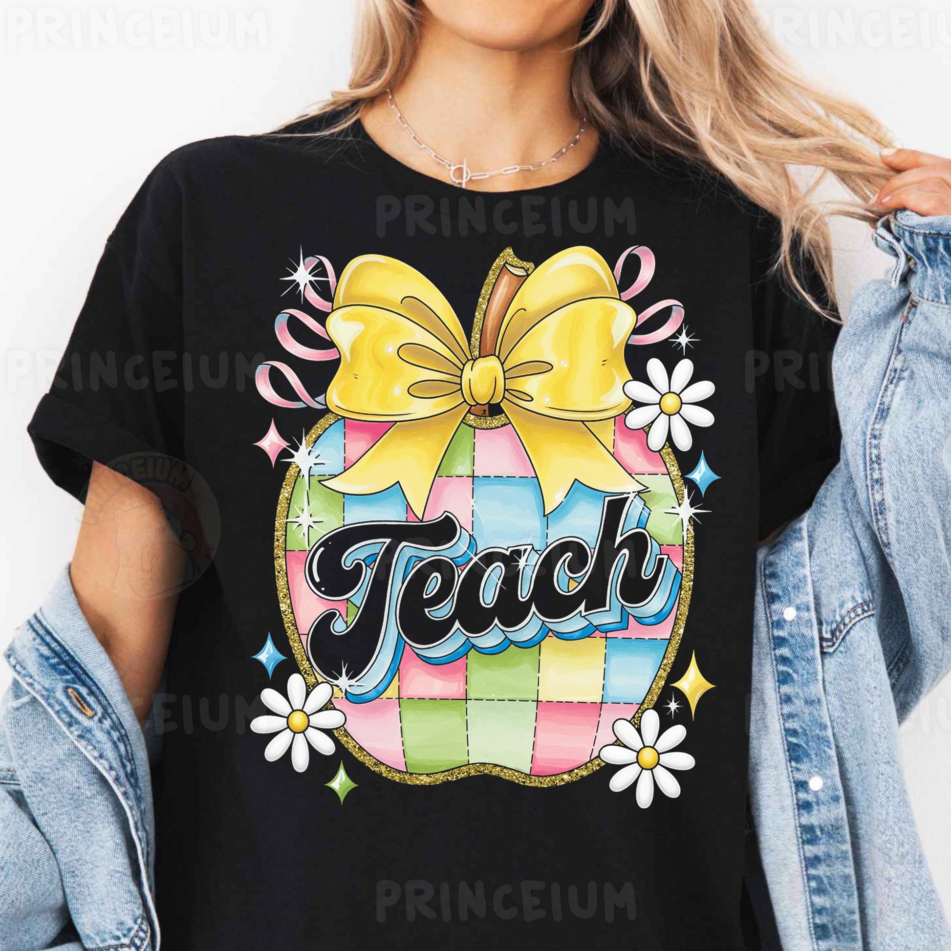 a woman wearing a black teacher shirt with a yellow bow