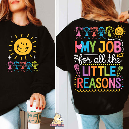 a woman wearing a black sweatshirt that says, my job for all the little reason