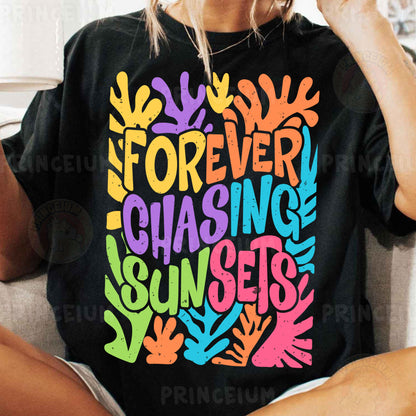 a woman sitting on a couch wearing a t - shirt that says forever chasing sunset