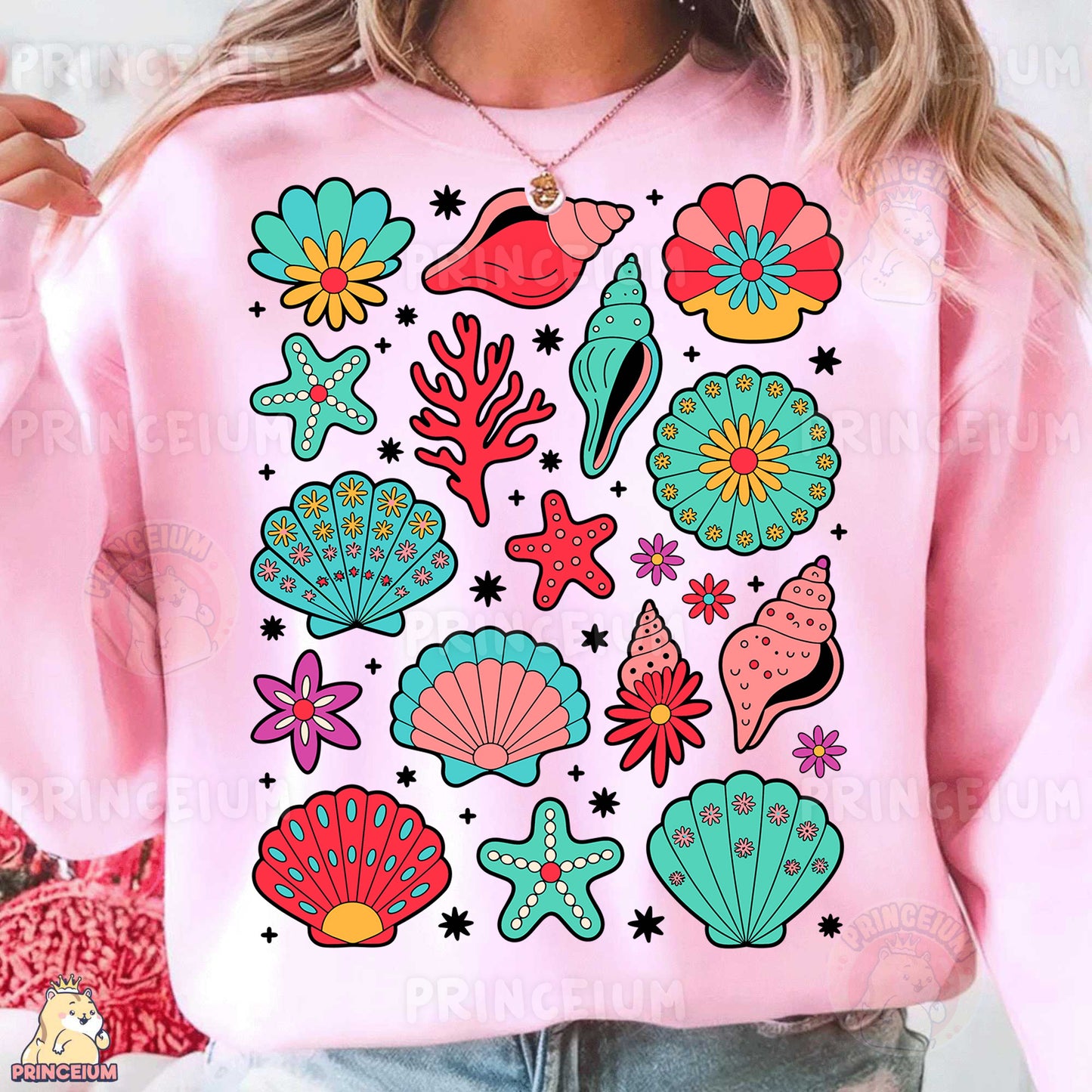 a woman wearing a pink sweatshirt with colorful seashells on it