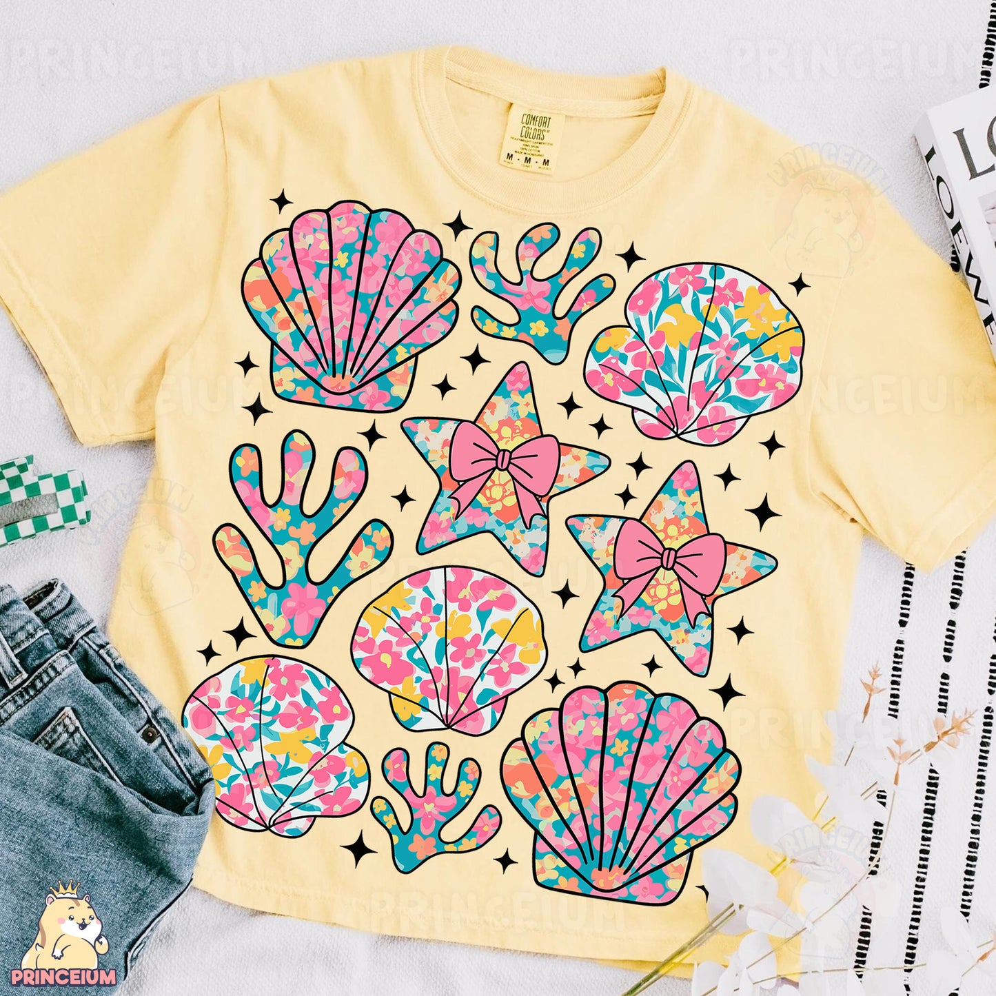 a t - shirt that has a bunch of seashells on it