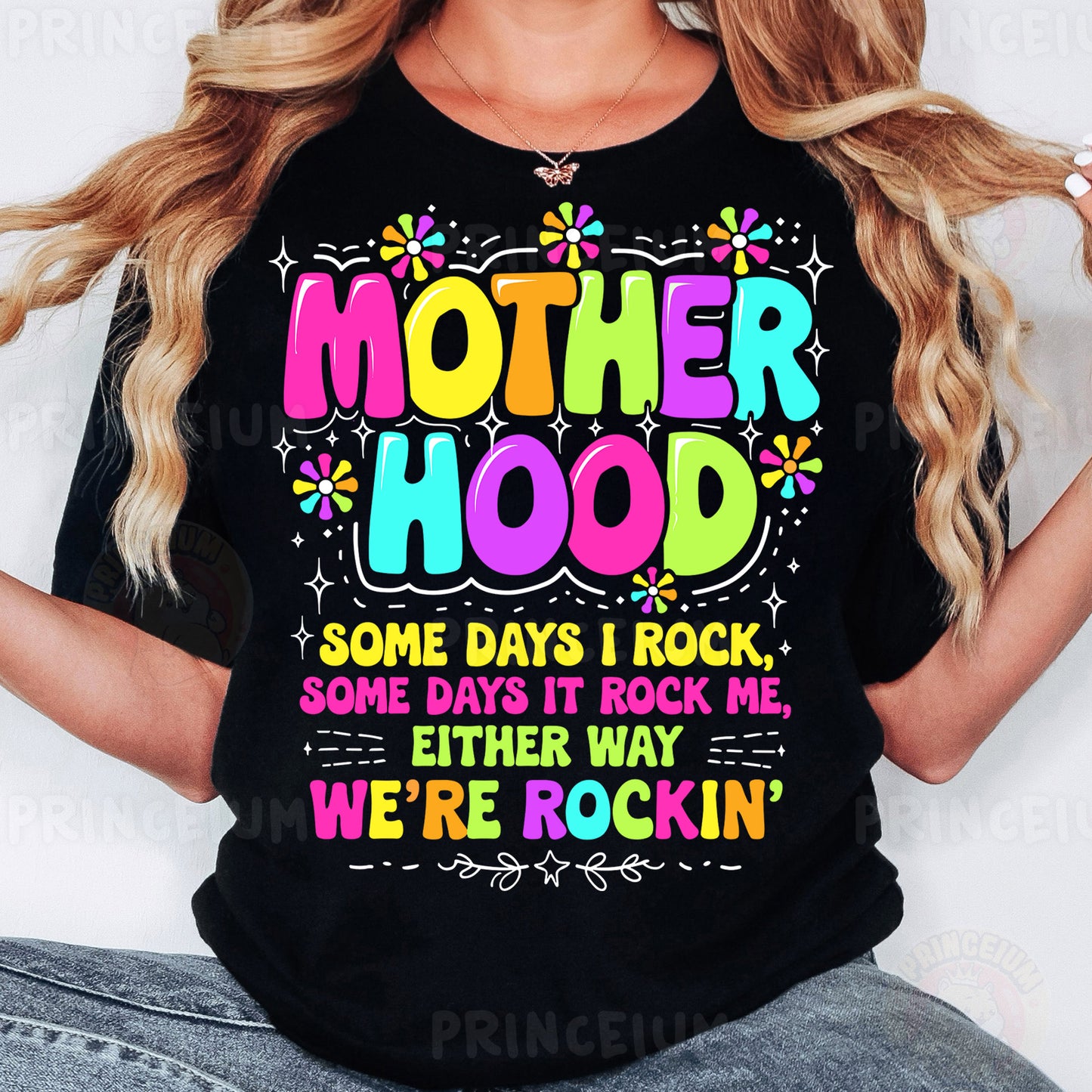 a woman wearing a t - shirt that says motherhood