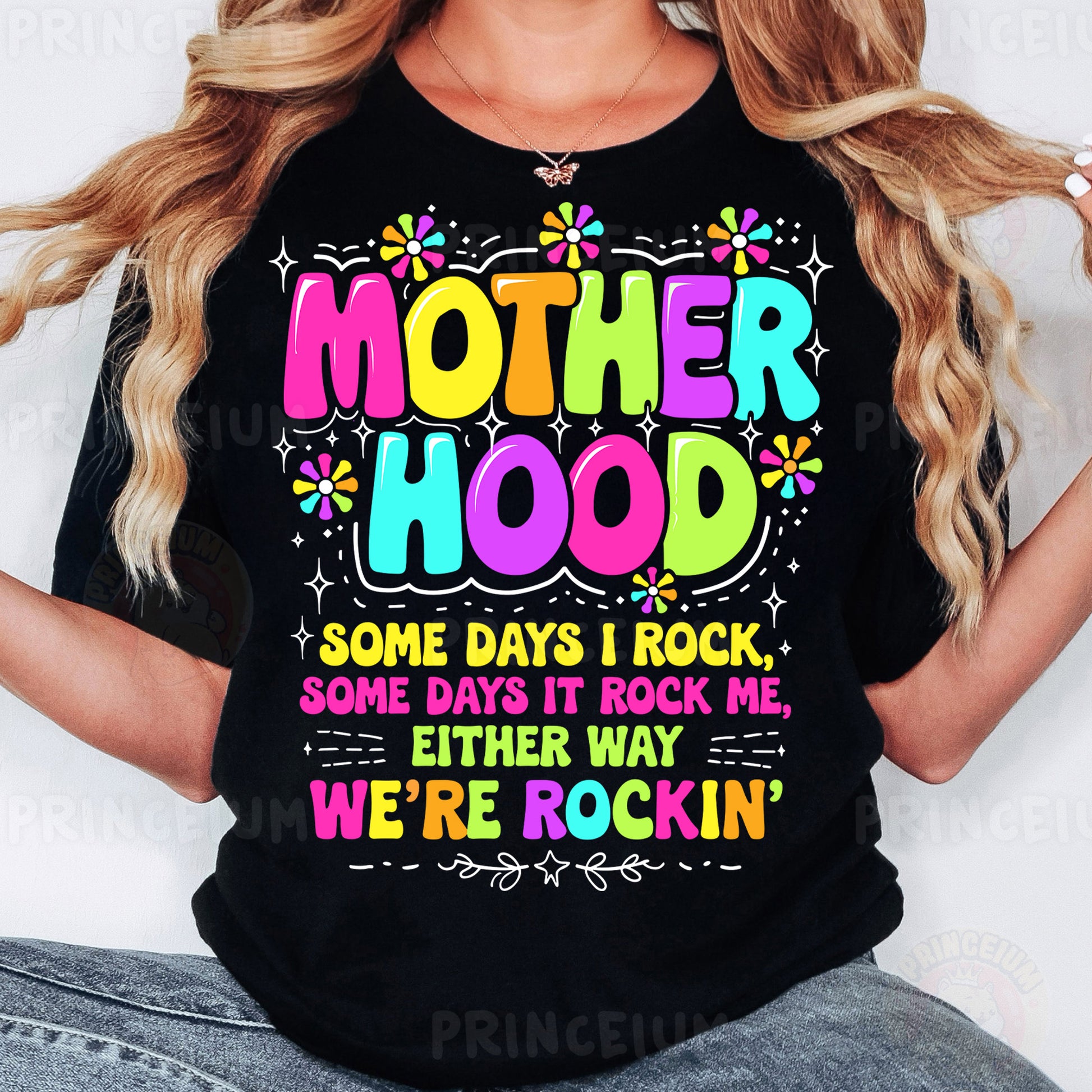 a woman wearing a t - shirt that says motherhood
