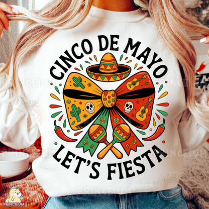 a woman wearing a cinco de mayo let's fiesta shirt