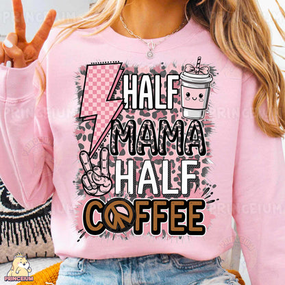 a woman wearing a pink shirt that says half mama half coffee