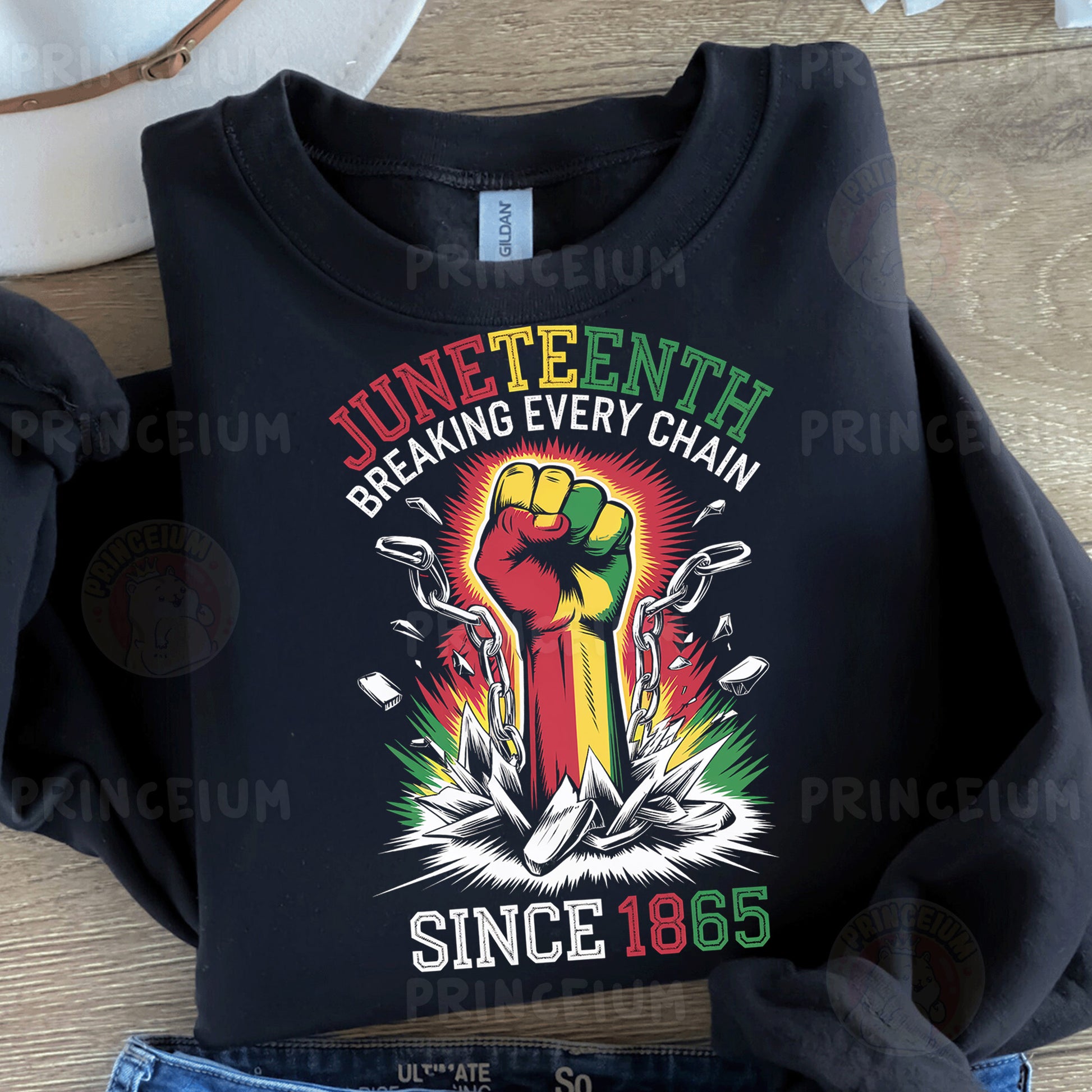 a black t - shirt with the words juneteeth breaking every chain since 1876