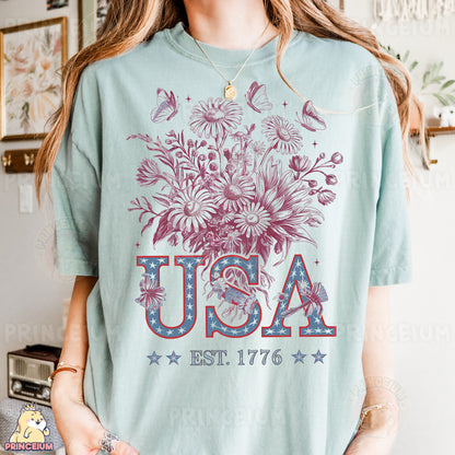 a woman wearing a usa t - shirt with a bouquet of flowers
