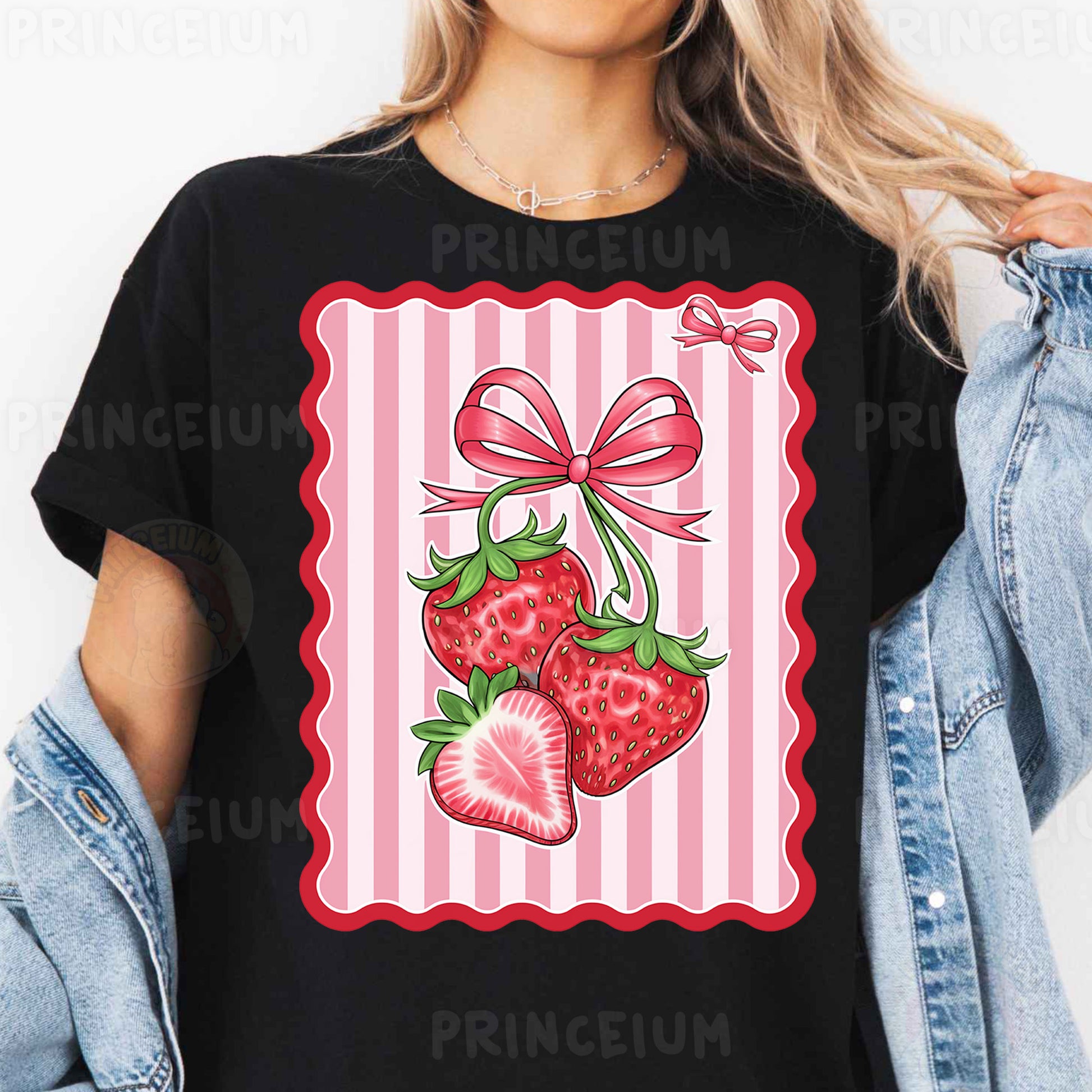 a woman wearing a black t - shirt with strawberries on it