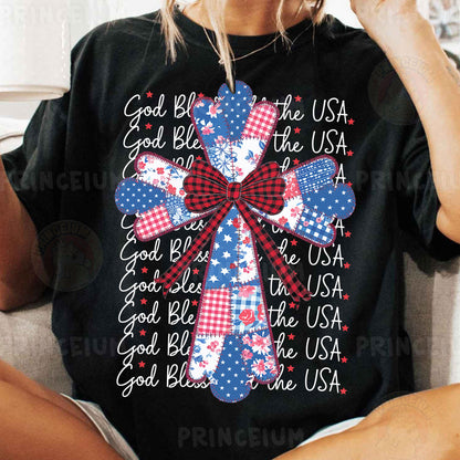a woman sitting on a couch wearing a black shirt with red, white and blue