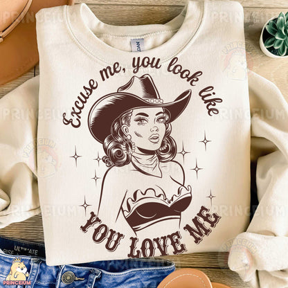 a t - shirt with a picture of a woman wearing a cowboy hat
