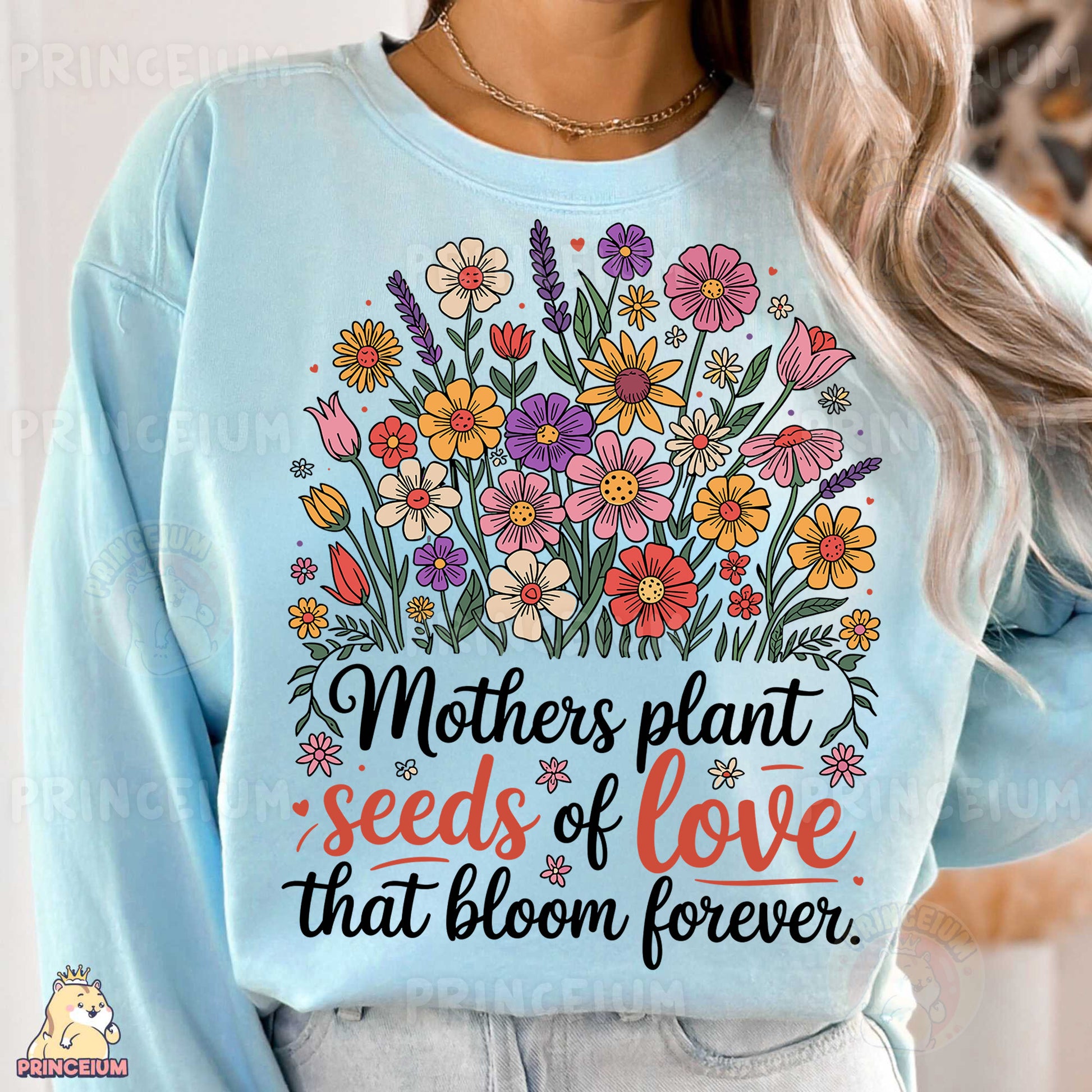 a woman wearing a blue sweatshirt with flowers on it