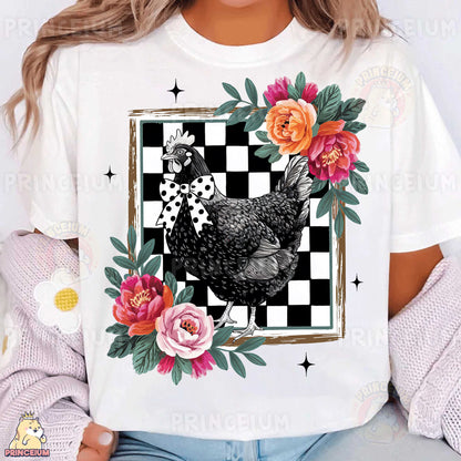 a woman wearing a t - shirt with a chicken and flowers on it