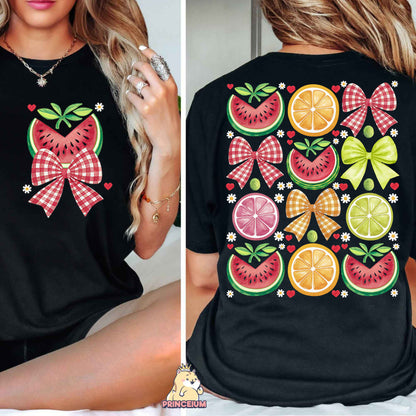 a woman wearing a black shirt with fruit on it