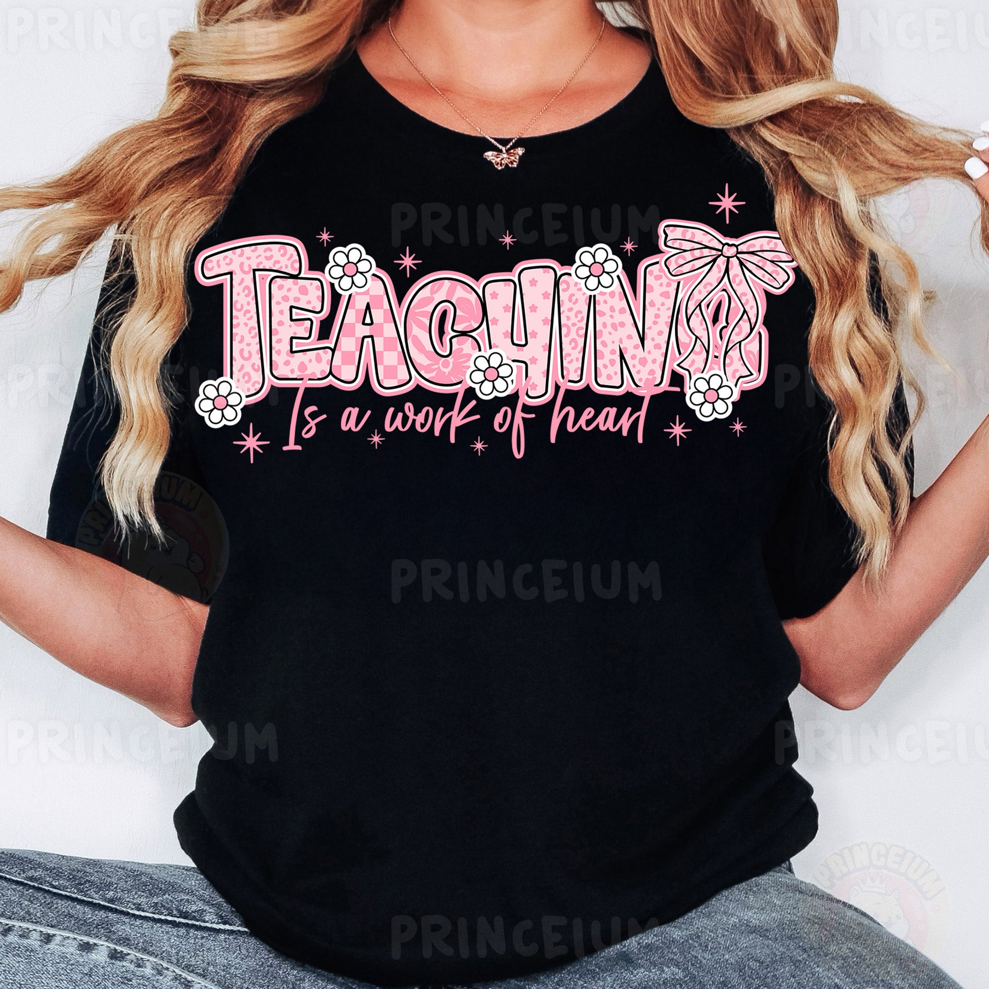 a woman with long blonde hair wearing a black t - shirt