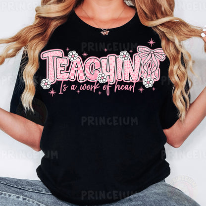 a woman with long blonde hair wearing a black t - shirt