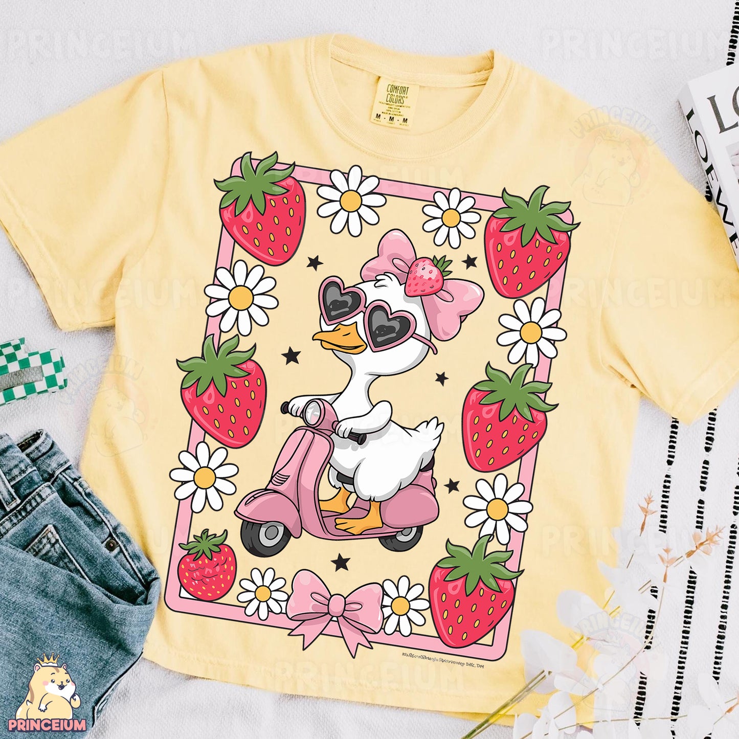 a yellow shirt with a duck riding a scooter